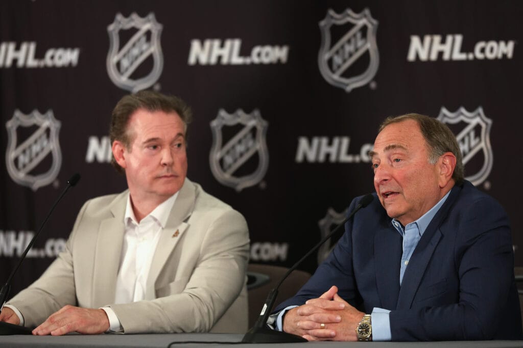 NHL Commissioner Gary Bettman speaks alongside former Coyotes owner Alex Meruelo during a news conference at Hyatt Regency Phoenix on April 19 to announce the $1.2 billion sale of the team from Meruelo to Utah Jazz owners Ryan and Ashley Smith.