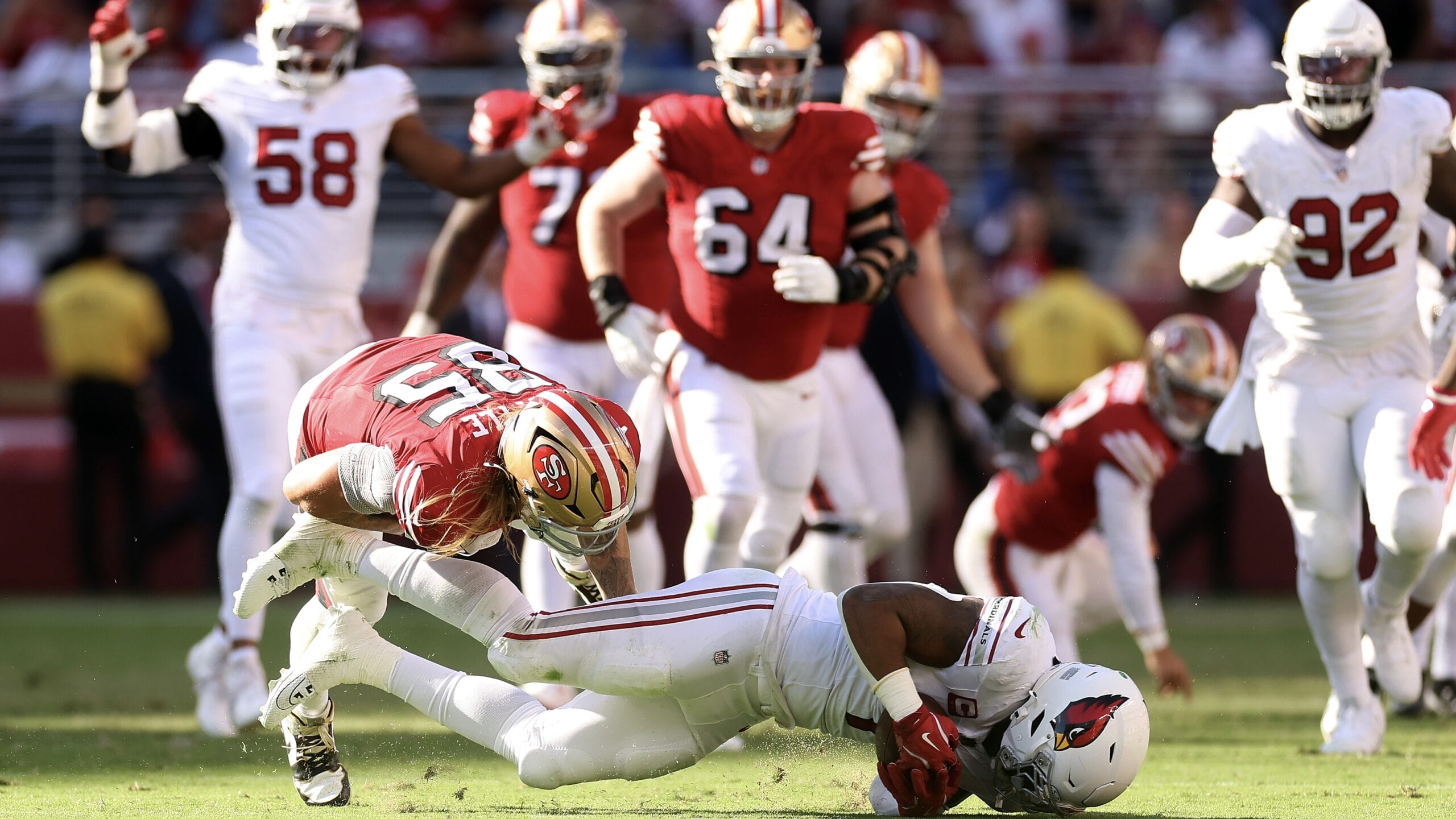 SANTA CLARA, CALIFORNIA - OCTOBER 06: Kyzir White #7 of the Arizona Cardinals intercepts a pass intended for George Kittle #85 of the San Francisco 49ers during the fourth quarter at Levi's Stadium on October 06, 2024 in Santa Clara, California. (Photo by Ezra Shaw/Getty Images)