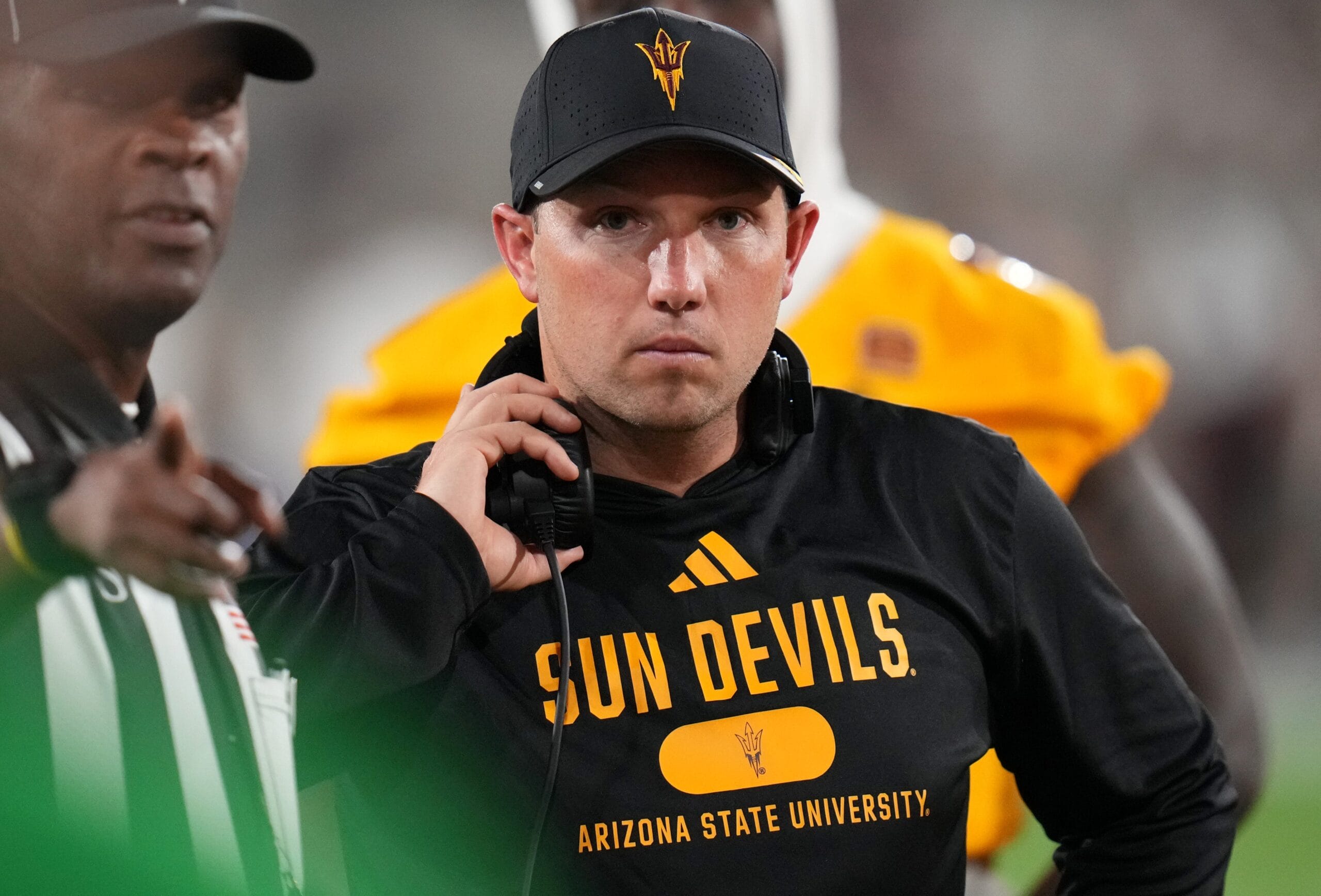 Arizona State head coach Kenny Dillingham speaks with a referee on the sidelines of a game against the Mississippi State Bulldogs at Mountain America Stadium on Sept. 7, 2024, in Tempe.