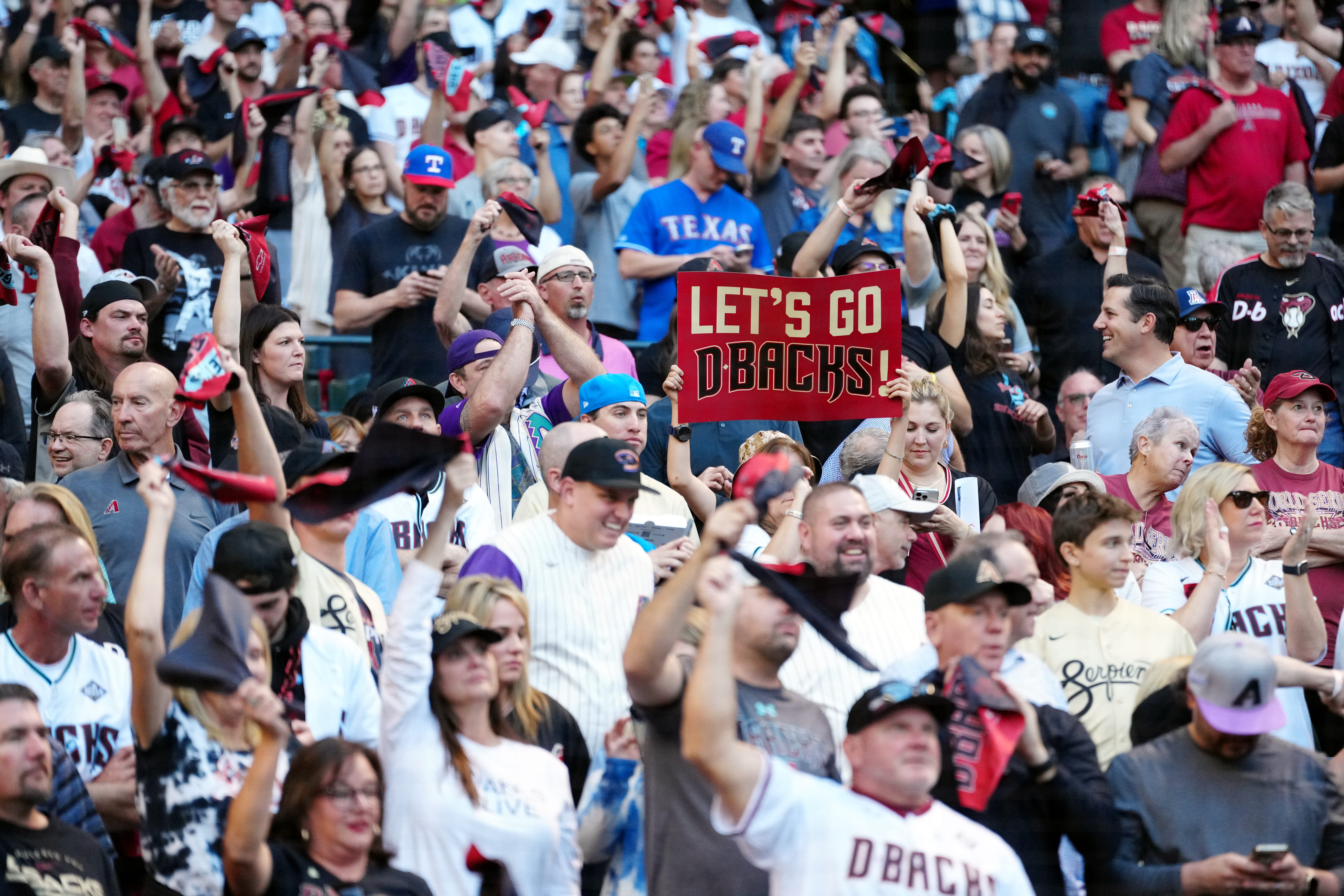 Fans hold up a sign prior to Game 5 of the 2023 World Series between the Texas Rangers and the Arizona Diamondbacks at Chase Field on Wednesday, November 1, 2023 in Phoenix, Arizona.